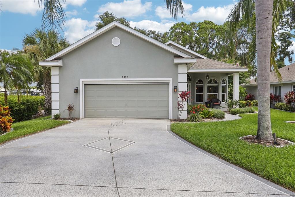2512 Baywater Road Tavares, FL 32778 - Photo 73 of 75 a view of a house with a yard and plants