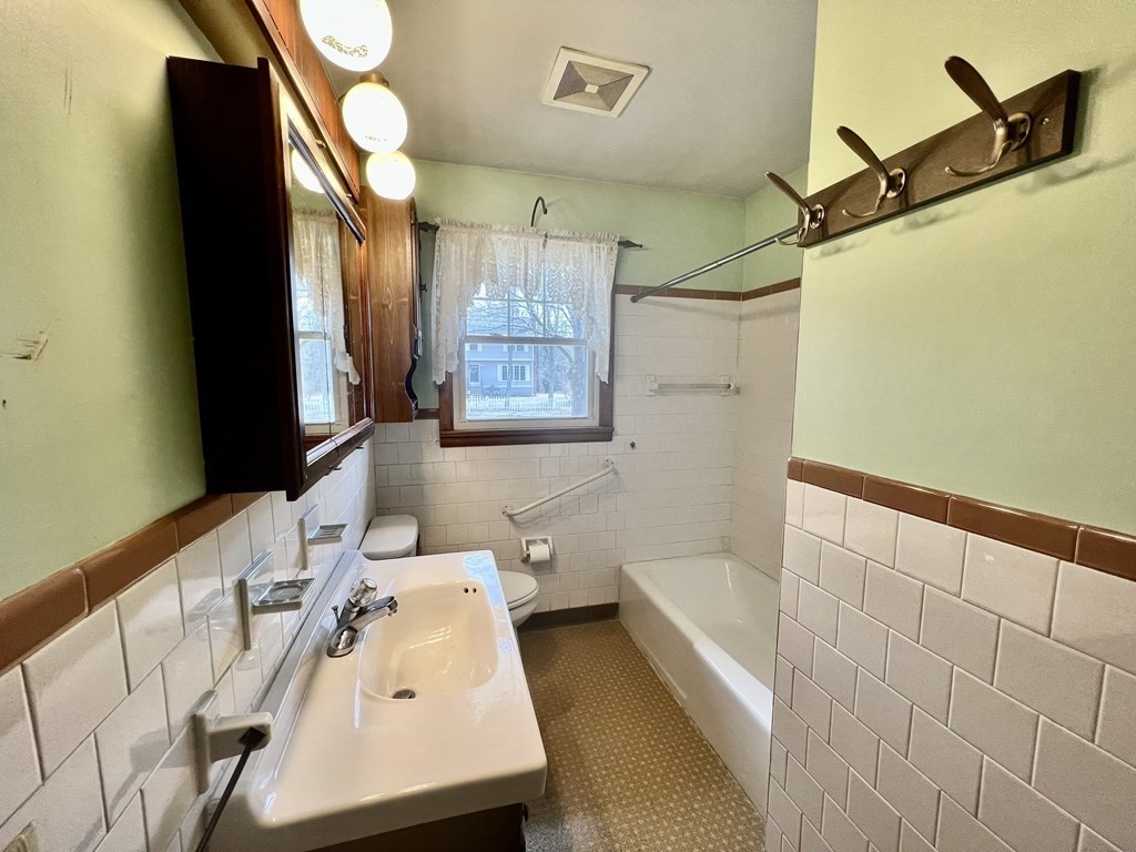 44 Burlingame Road Charlton, MA 01507 - Photo 14 of 29 a bathroom with a sink and a bathtub