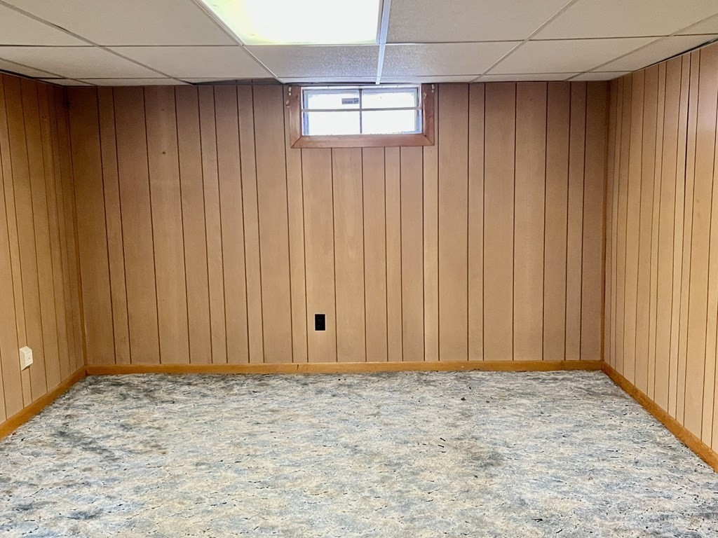 44 Burlingame Road Charlton, MA 01507 - Photo 16 of 29 an empty room with wooden walls