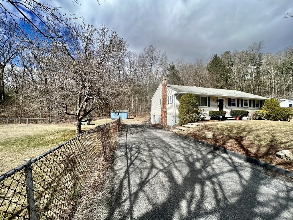 44 Burlingame Road Charlton, MA 01507 - Photo 25 of 29 a view of a house with a yard covered with snow in front of house