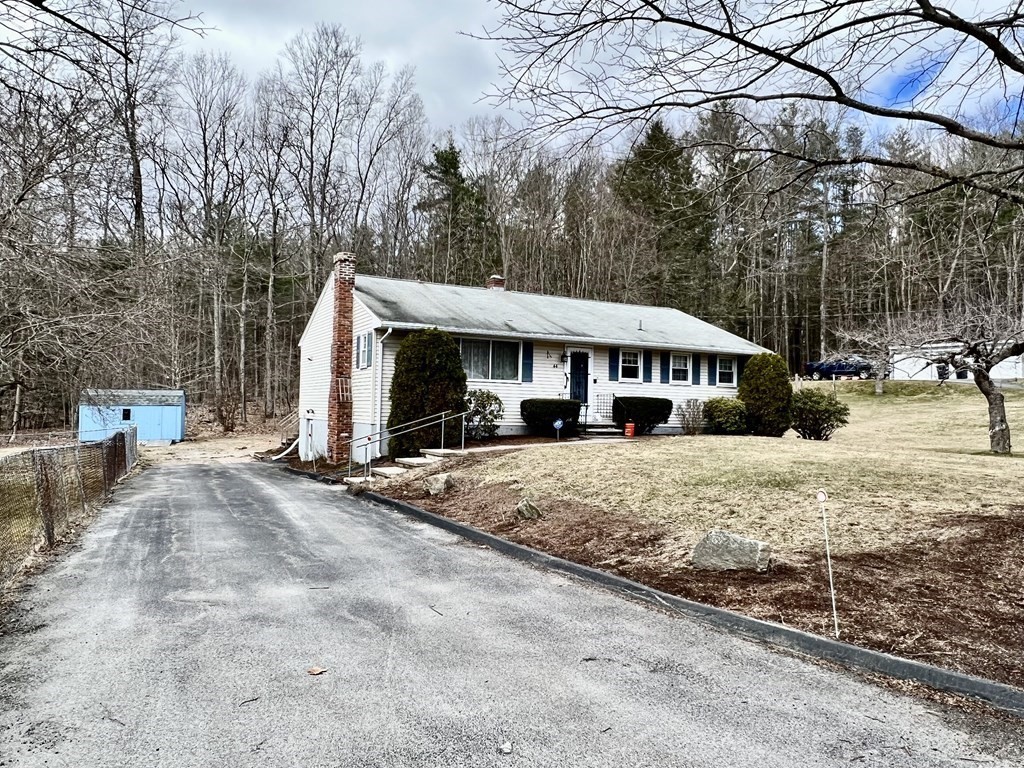 44 Burlingame Road Charlton, MA 01507 - Photo 27 of 29 a view of a white house with a large tree in front of it