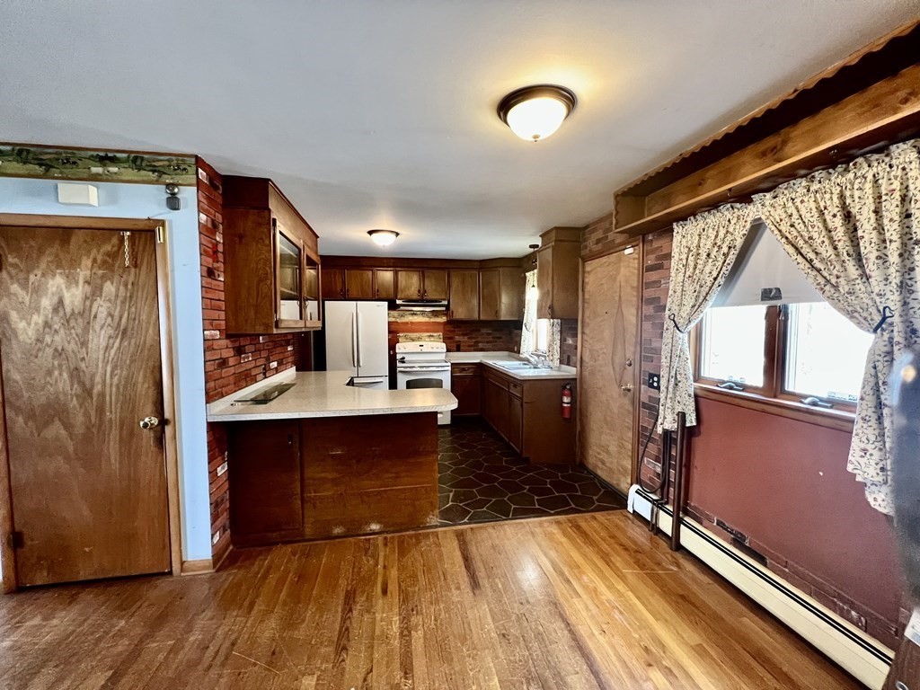 44 Burlingame Road Charlton, MA 01507 - Photo 5 of 29 a room with wooden floor and furniture