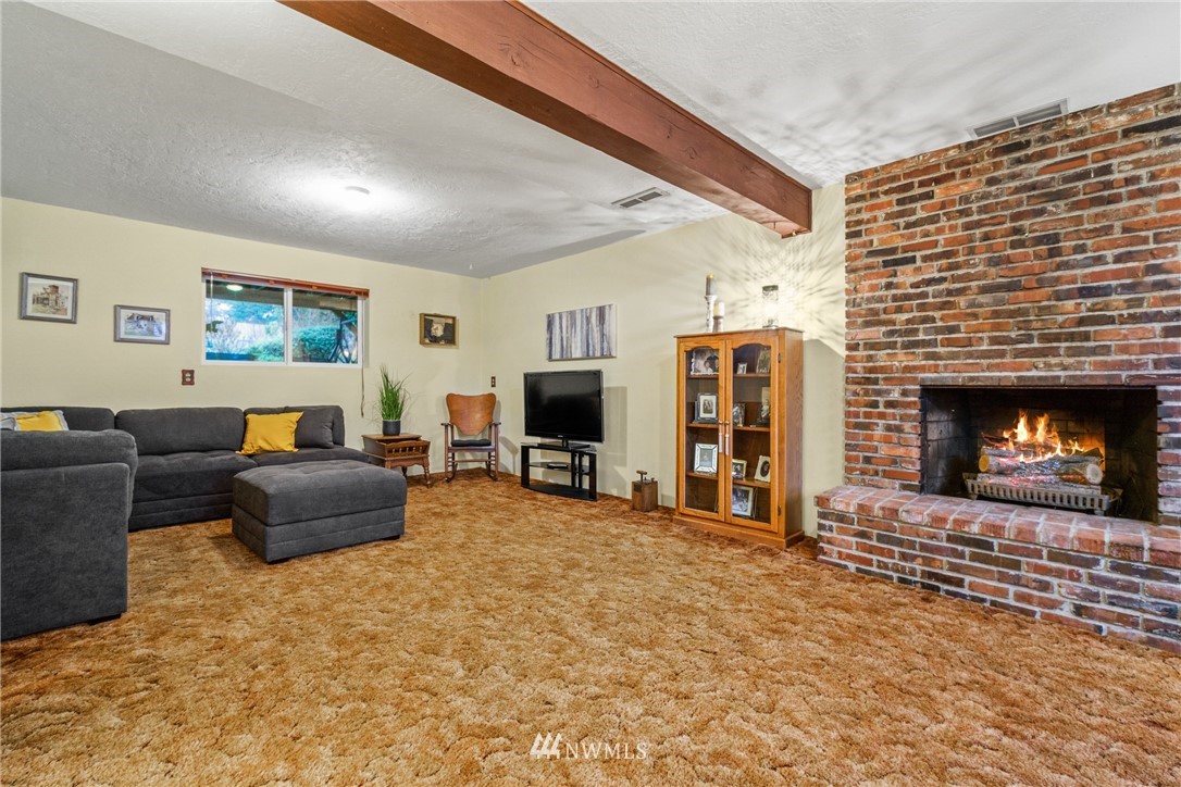 22508 3rd Place West Bothell, WA 98021 - Photo 19 of 23 a living room with furniture and a fireplace