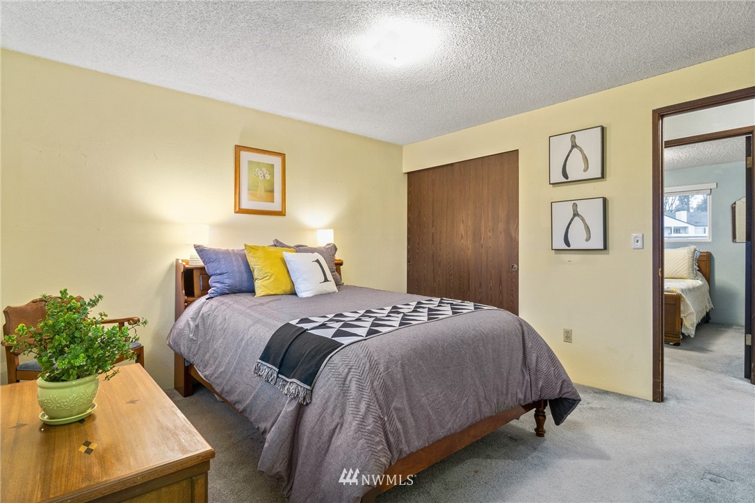 22508 3rd Place West Bothell, WA 98021 - Photo 10 of 23 a bedroom with a bed and painting on the wall