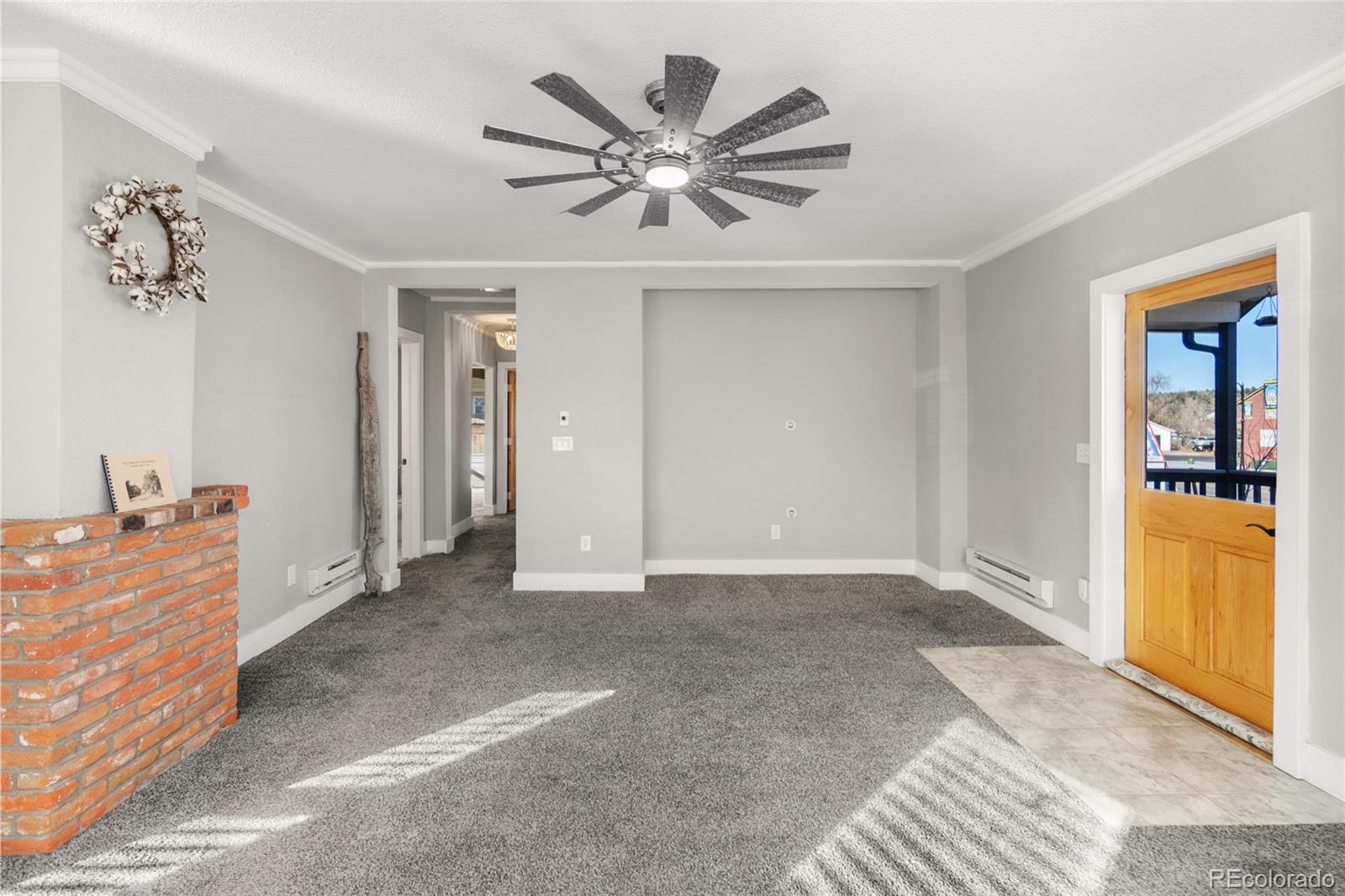 375 Main Street Elizabeth, CO 80107 - Photo 12 of 43 a view of work space with a ceiling fan