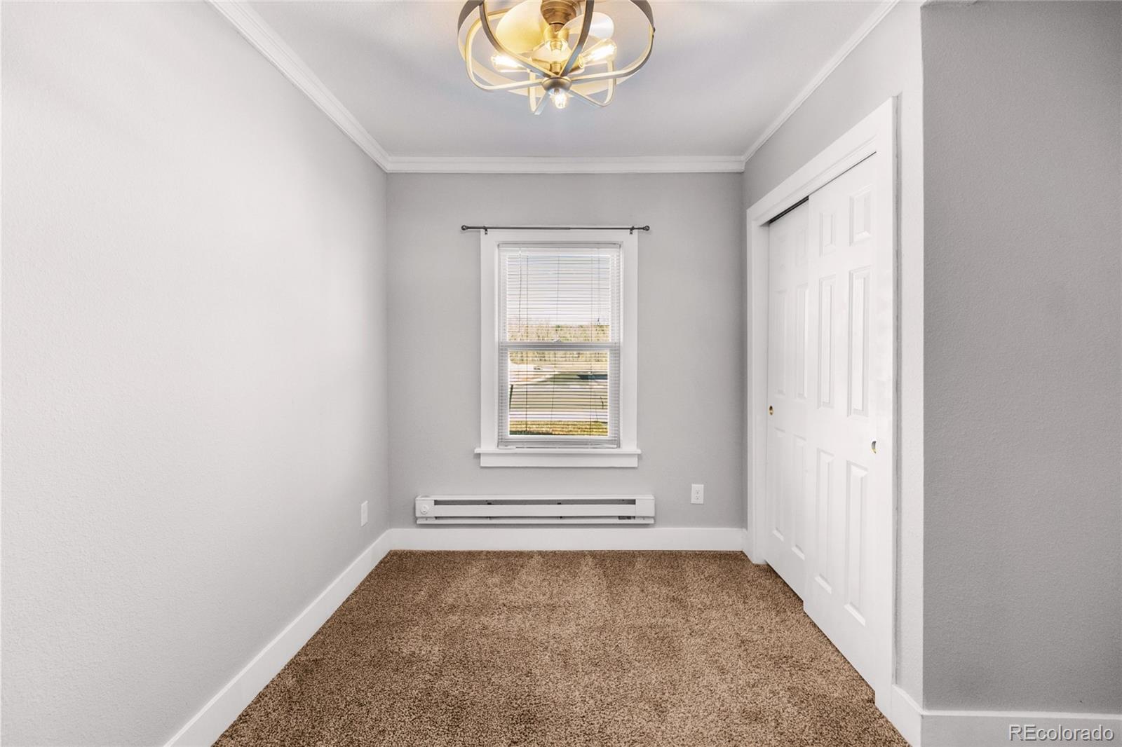 375 Main Street Elizabeth, CO 80107 - Photo 19 of 43 an empty room with a window