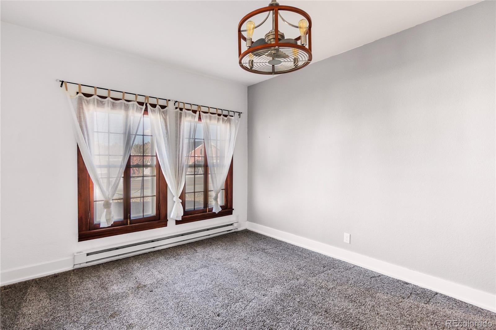 375 Main Street Elizabeth, CO 80107 - Photo 24 of 43 an empty room with a window