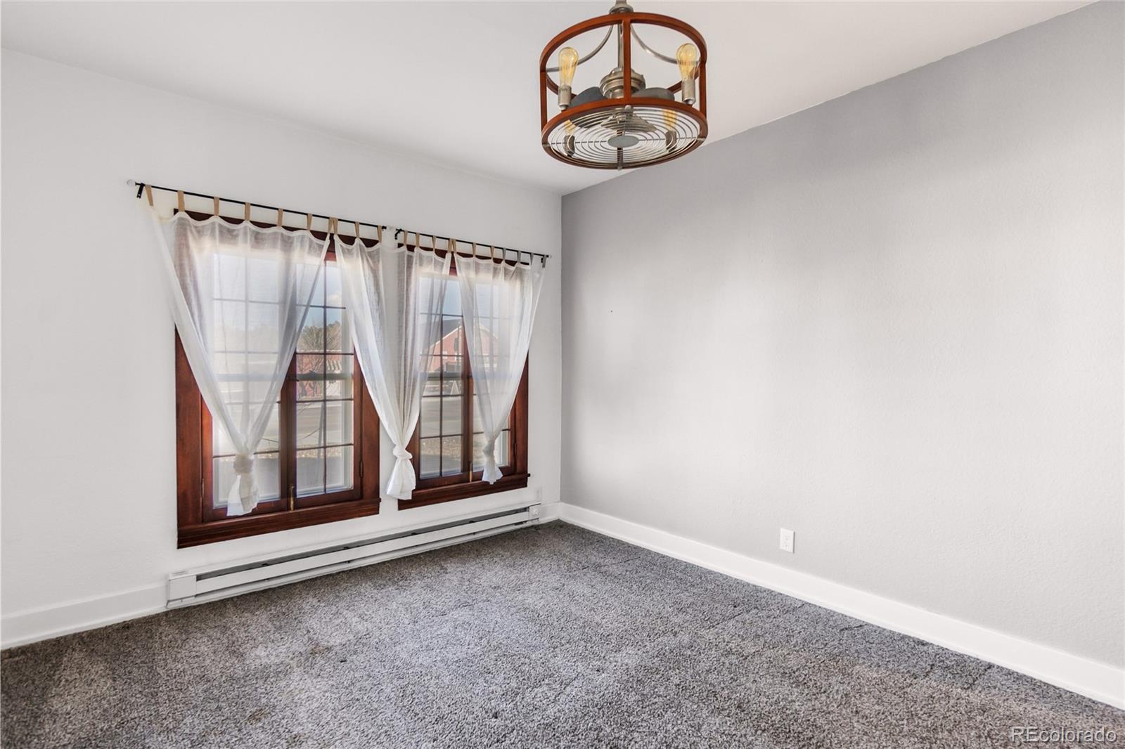 375 Main Street Elizabeth, CO 80107 - Photo 25 of 43 an empty room with a window