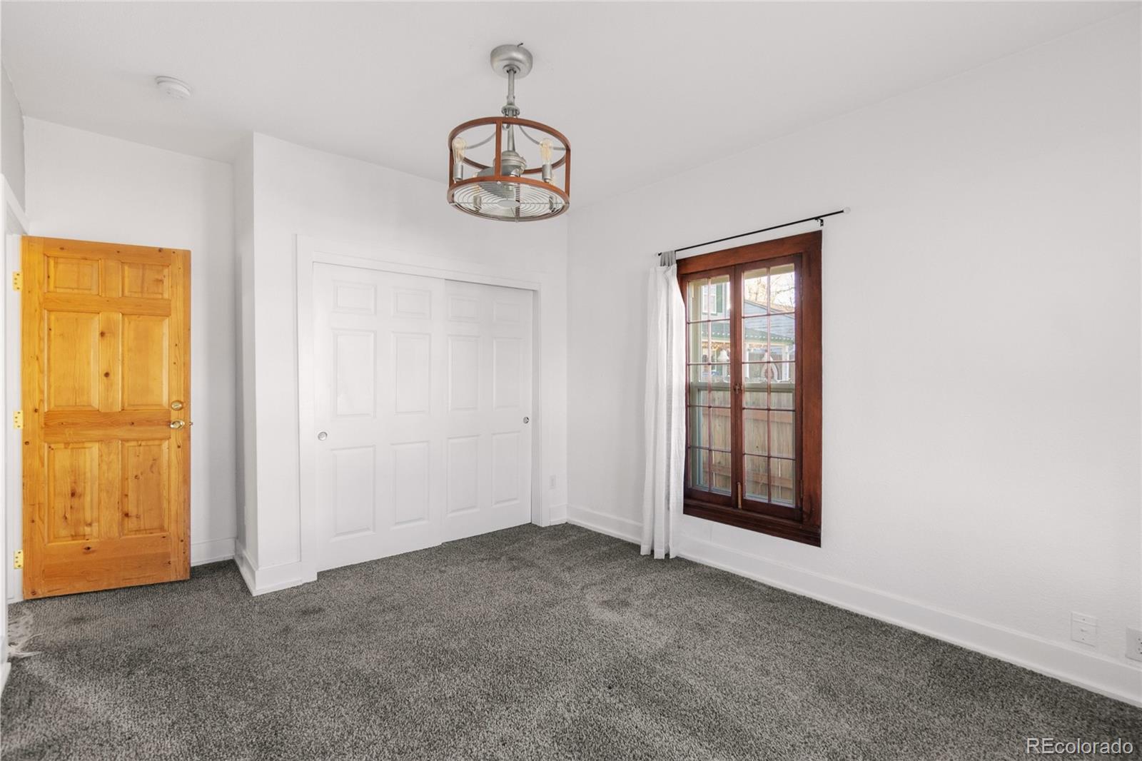 375 Main Street Elizabeth, CO 80107 - Photo 28 of 43 an empty room with windows and closet
