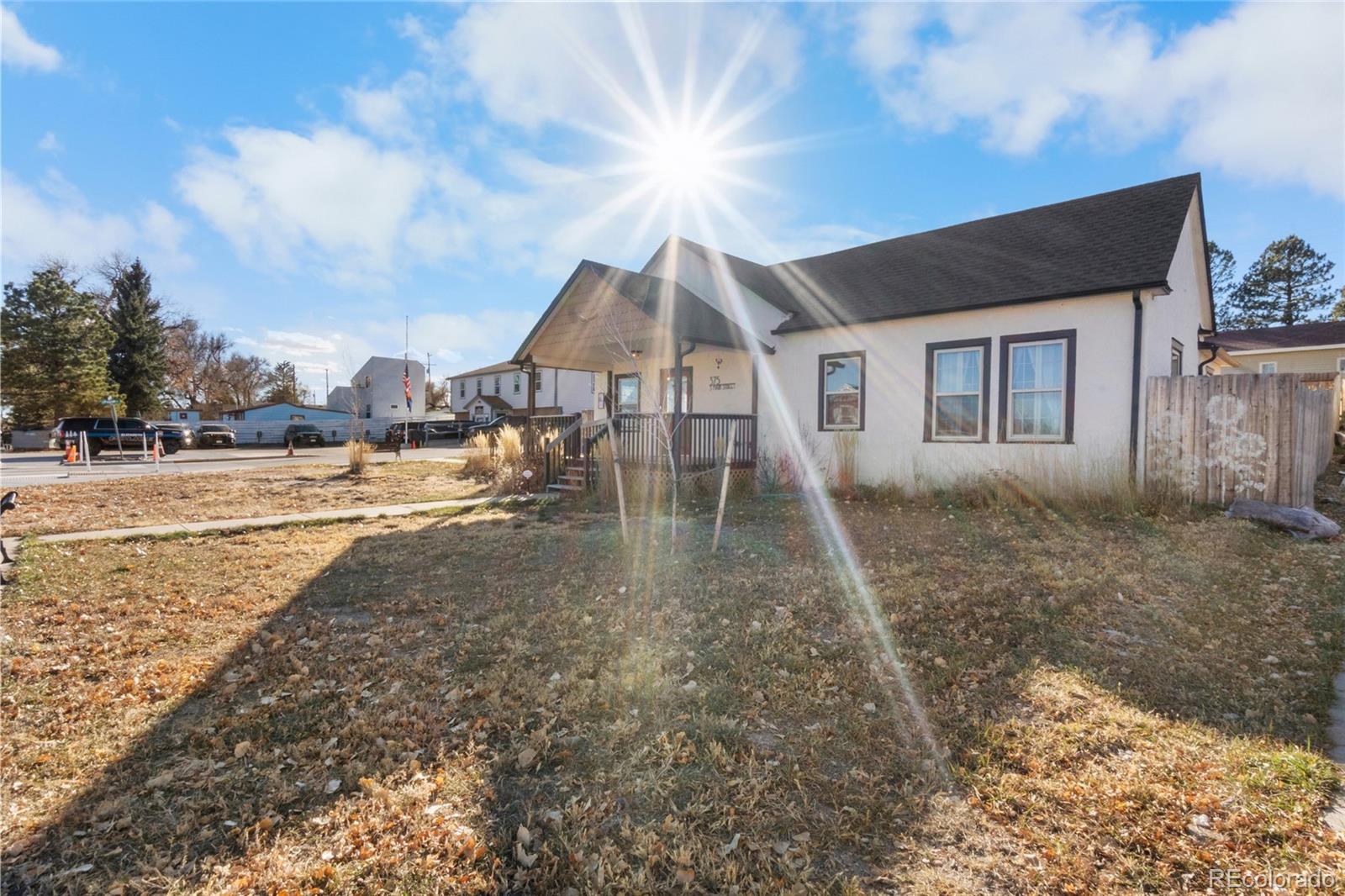 375 Main Street Elizabeth, CO 80107 - Photo 3 of 43 a backyard of a house with table and chairs