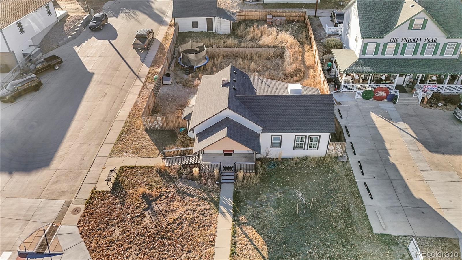 375 Main Street Elizabeth, CO 80107 - Photo 38 of 43 an aerial view of a house with large trees