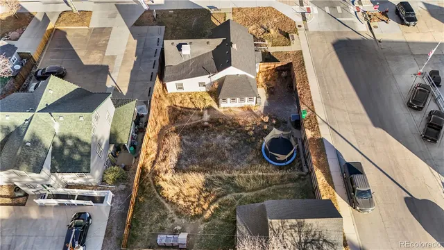 an aerial view of a house with a yard