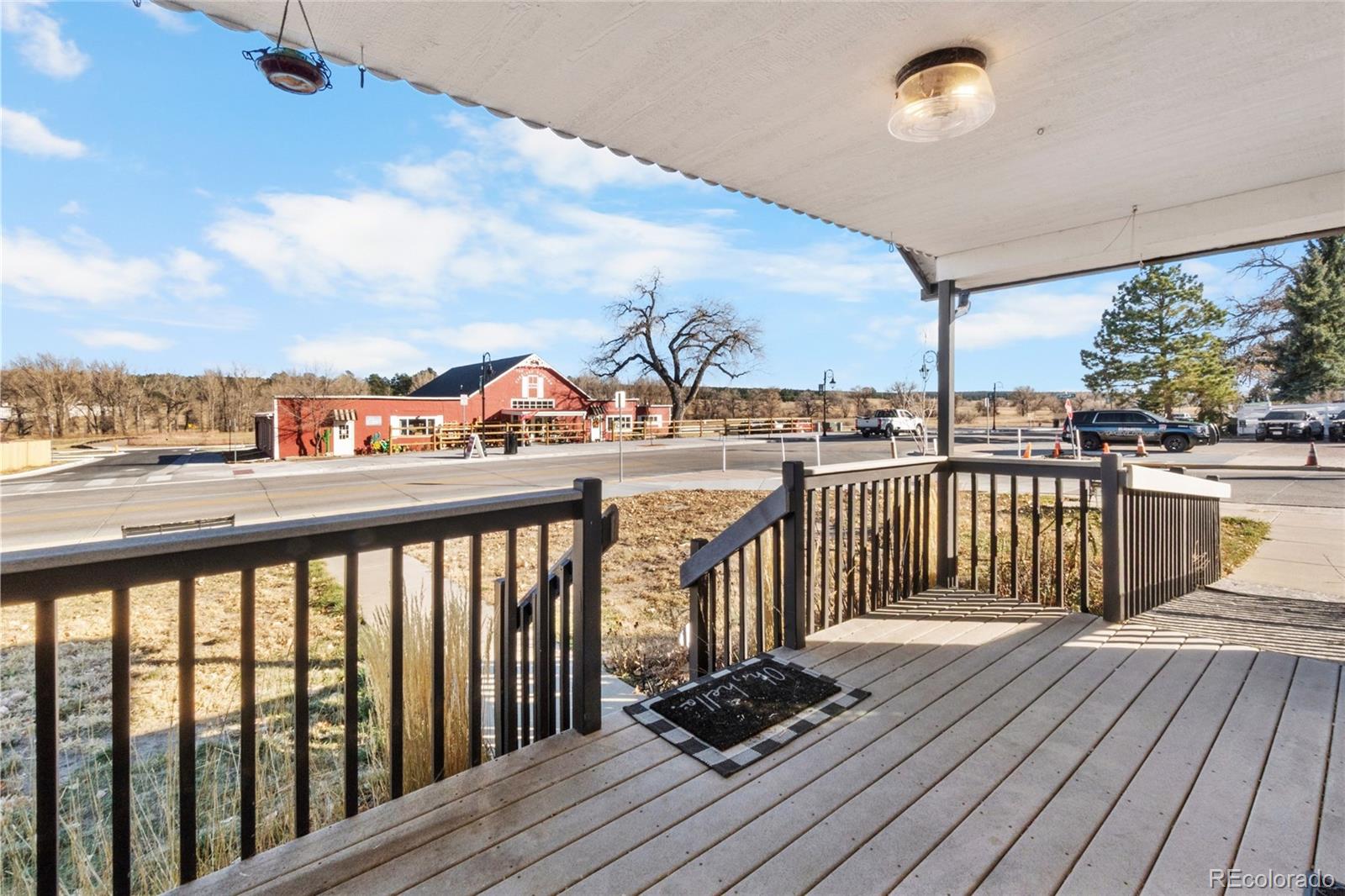 375 Main Street Elizabeth, CO 80107 - Photo 5 of 43 a view of a balcony with wooden floor