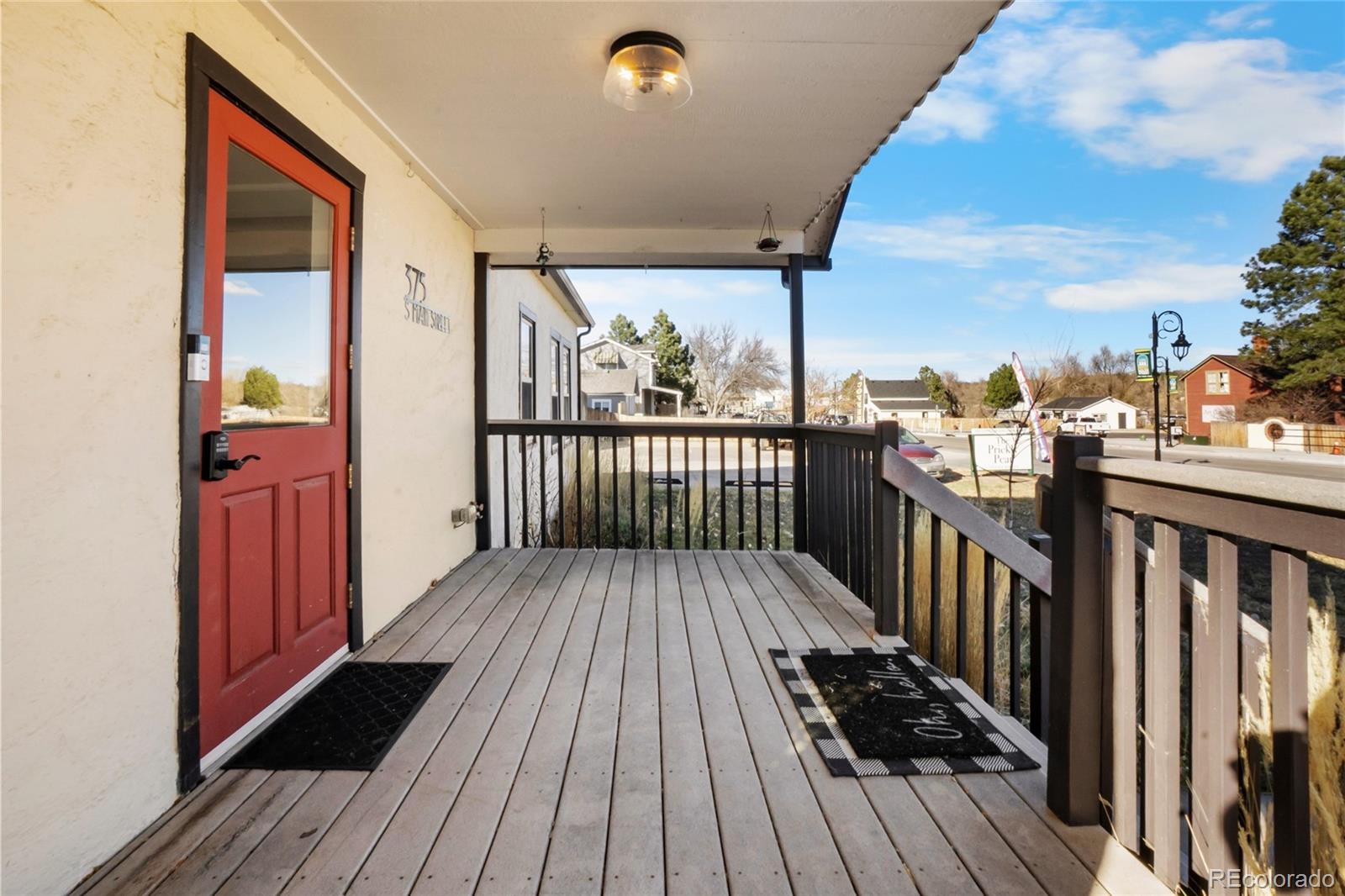 375 Main Street Elizabeth, CO 80107 - Photo 6 of 43 a view of a balcony with wooden floor