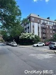 a view of street with parked cars