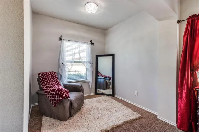 a bed room with a bed and a chandelier