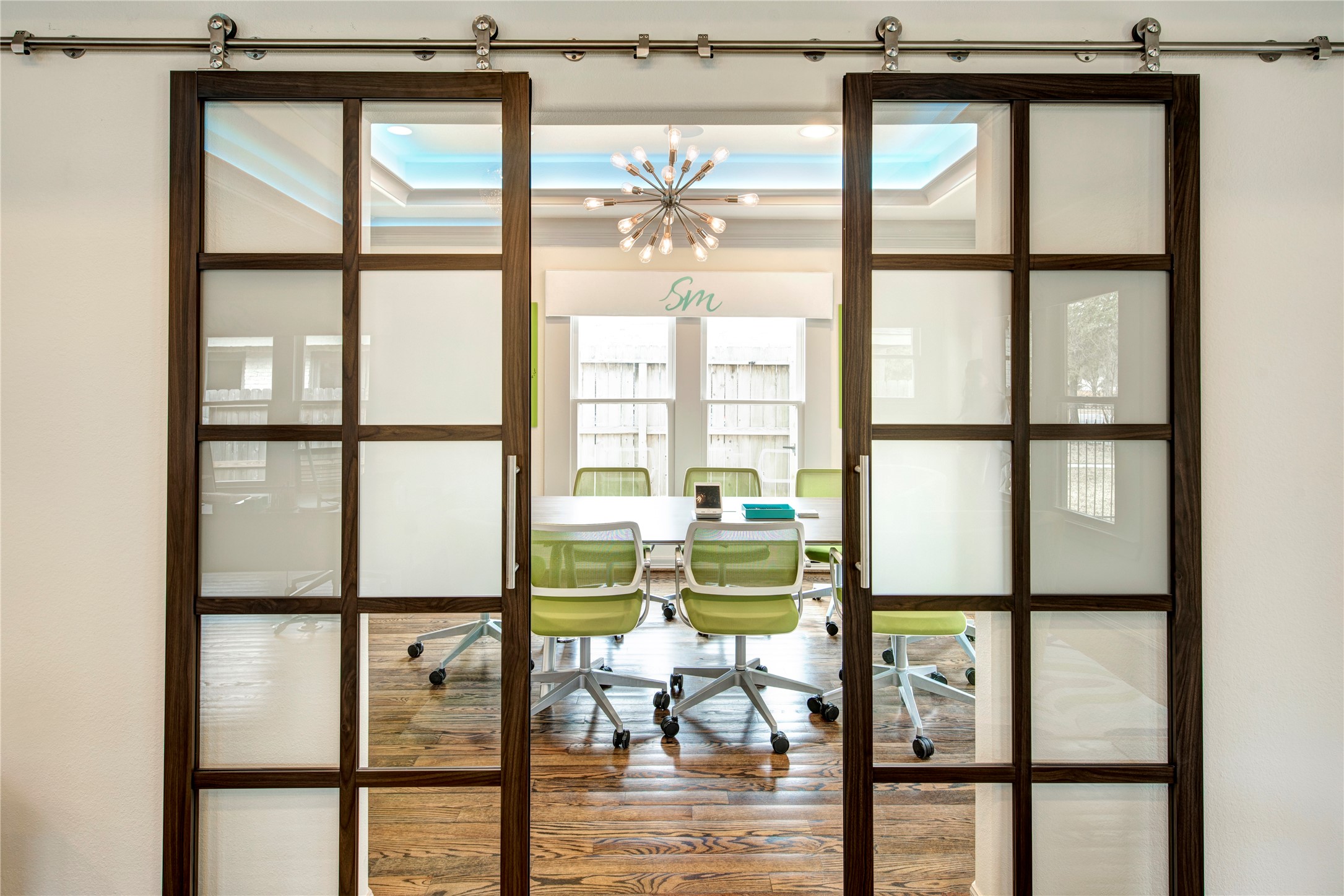 638 Heights Boulevard Houston, TX 77007 - Photo 13 of 49 Framed glass sliding doors allow natural light to flow freely while providing privacy when needed. This versatile room is perfectly suited for a formal dining area, private study, media room, or home office, with the added bonus of potential commercial use thanks to the flexible zoning.