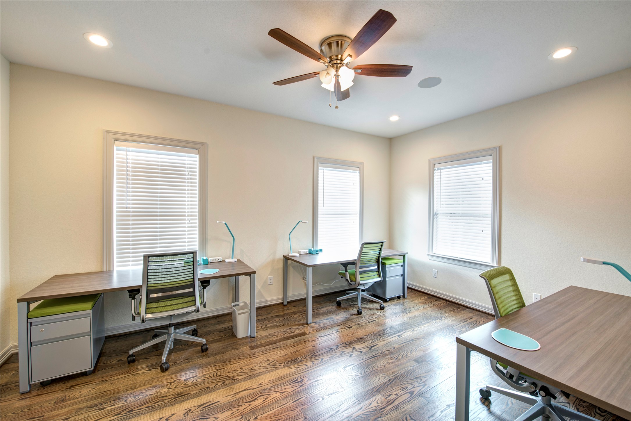 638 Heights Boulevard Houston, TX 77007 - Photo 26 of 49 Another roomy upstairs bedroom offers rich hardwood floors, recessed lighting, and a ceiling fan for added comfort. Oversized windows invite in natural light, creating a bright and airy atmosphere. With ample space for furnishings, this room easily functions as a bedroom, shared space, or home office to fit your needs.