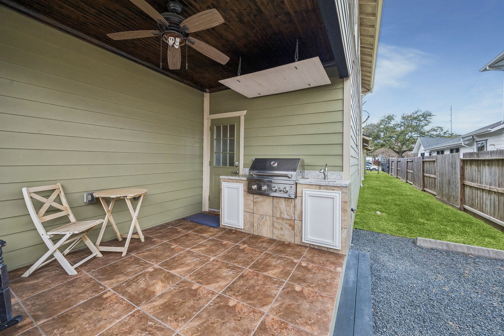 638 Heights Boulevard Houston, TX 77007 - Photo 32 of 49 The covered back patio accesses the fenced yard space, a pedestrian gate with access to the alley, and the back parking area with room for up to three cars off the alley in addition to a 2 car garage.