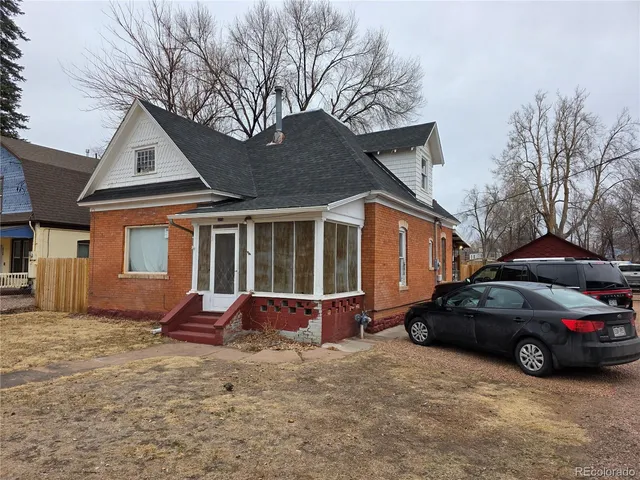 a car parked in front of a house