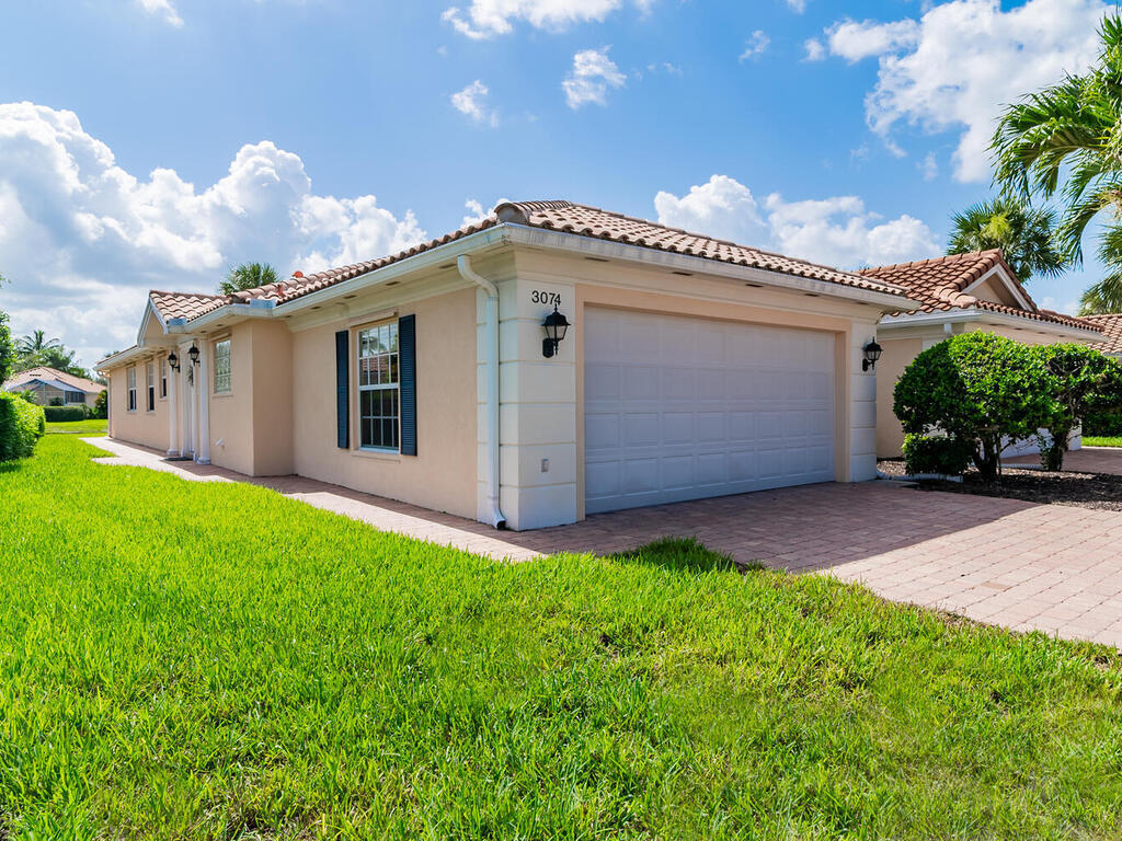 3074 Futuna Lane Naples, FL 34119 - Photo 1 of 28 a view of a back yard of the house