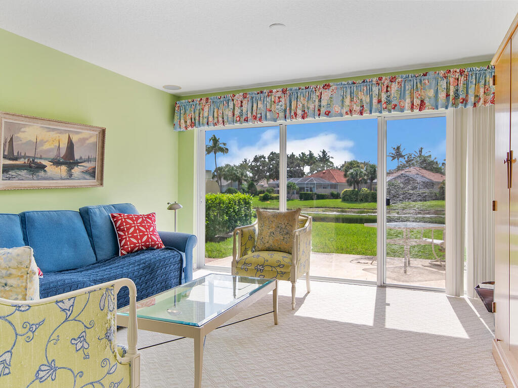 3074 Futuna Lane Naples, FL 34119 - Photo 11 of 28 a living room with furniture and a large window