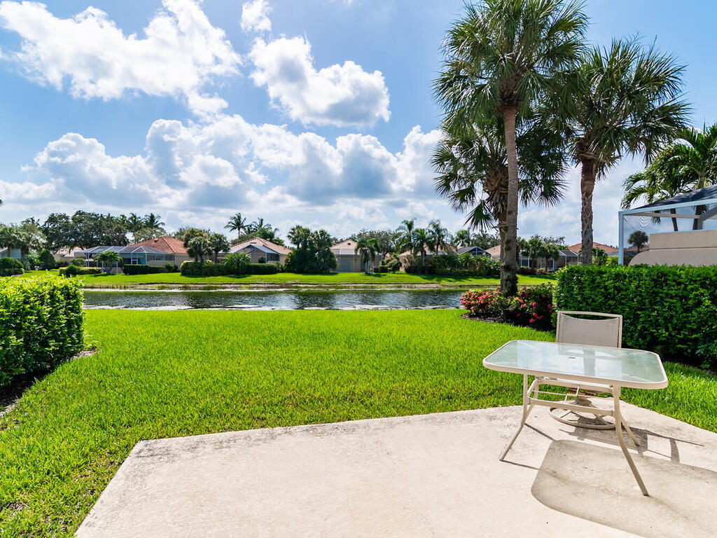 3074 Futuna Lane Naples, FL 34119 - Photo 12 of 28 a view of a table and chairs in the garden
