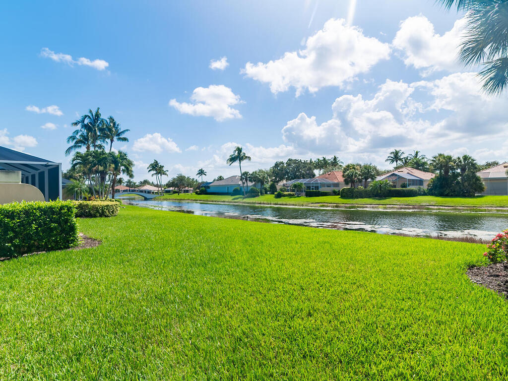 3074 Futuna Lane Naples, FL 34119 - Photo 13 of 28 a view of a golf course with a lake