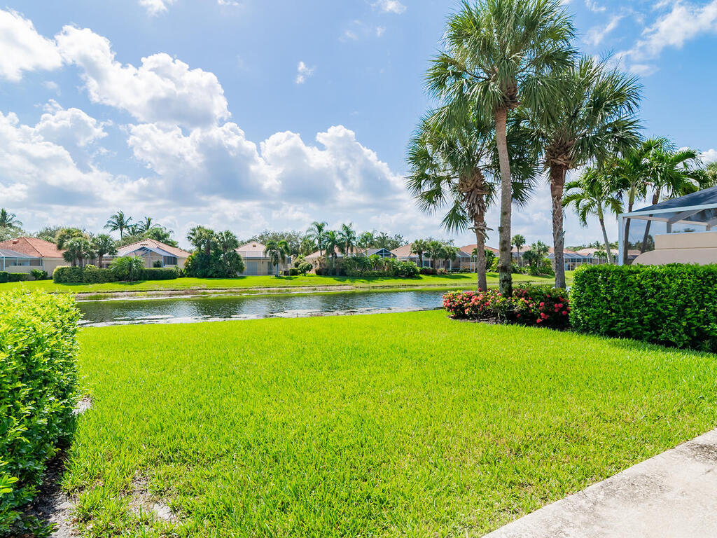 3074 Futuna Lane Naples, FL 34119 - Photo 14 of 28 a view of a swimming pool and a yard