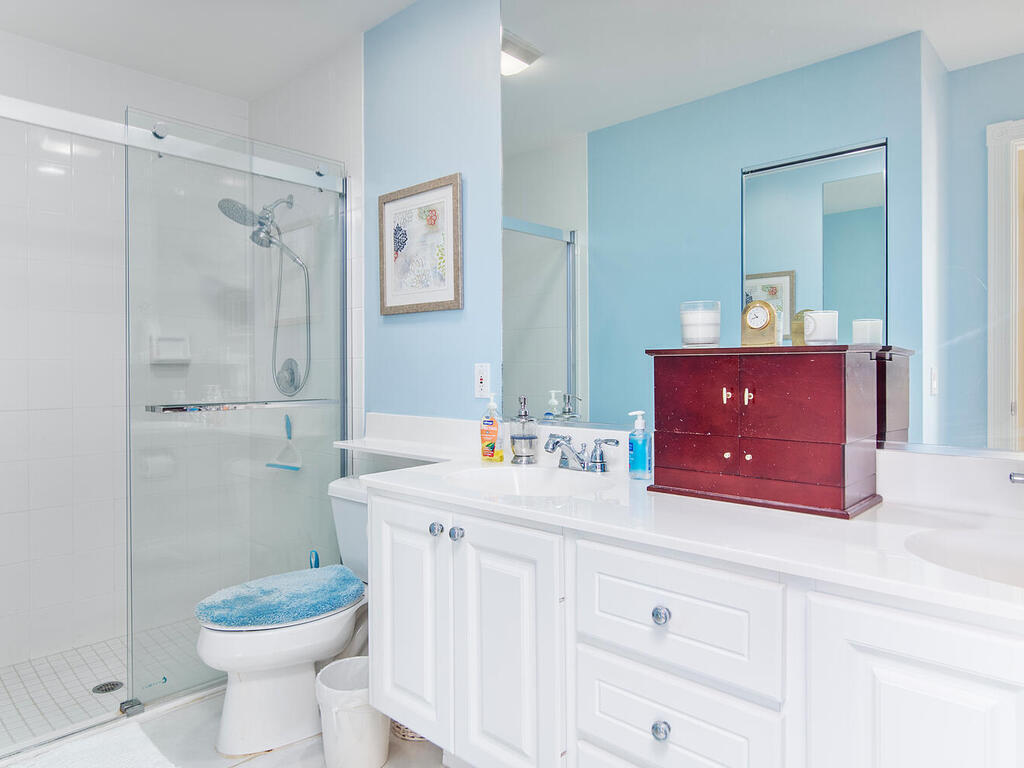 3074 Futuna Lane Naples, FL 34119 - Photo 17 of 28 a bathroom with a sink a toilet and shower