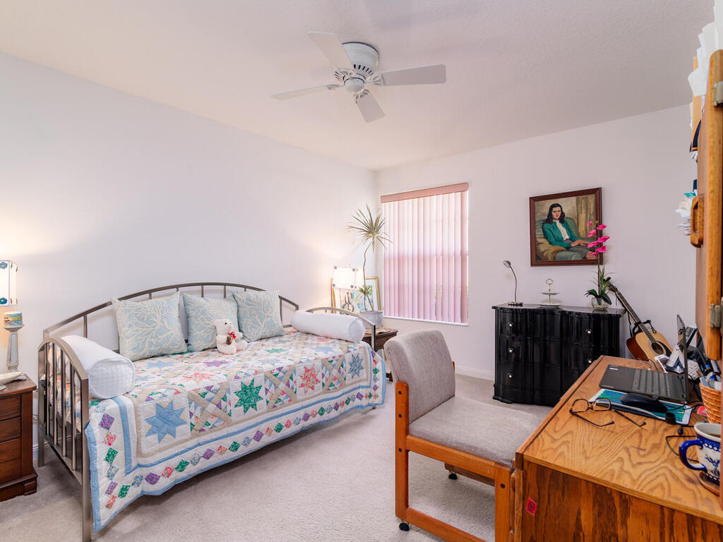 3074 Futuna Lane Naples, FL 34119 - Photo 18 of 28 a bedroom with bed and window