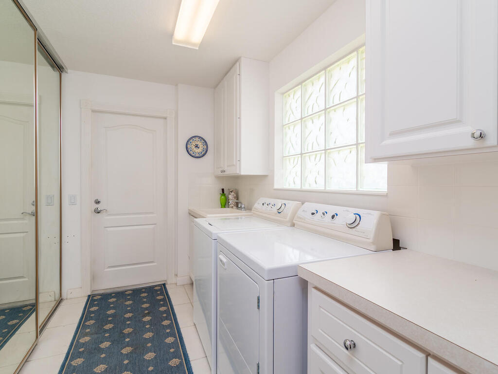 3074 Futuna Lane Naples, FL 34119 - Photo 20 of 28 a utility room with dryer and washer