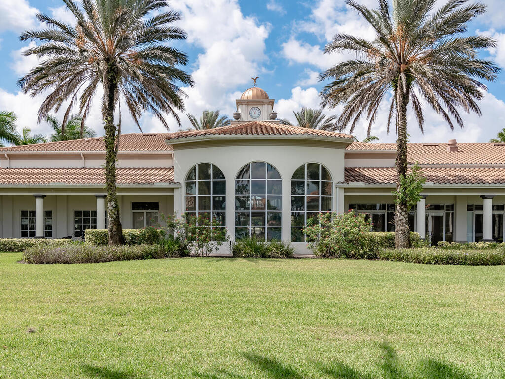 3074 Futuna Lane Naples, FL 34119 - Photo 22 of 28 front view of a house with a garden