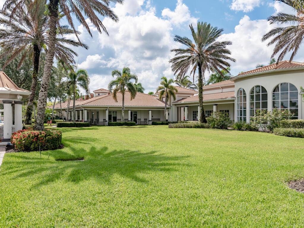 3074 Futuna Lane Naples, FL 34119 - Photo 23 of 28 a front view of a house with a garden