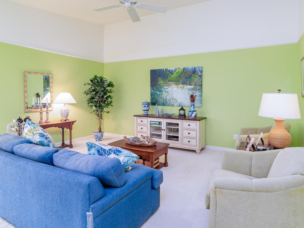 3074 Futuna Lane Naples, FL 34119 - Photo 3 of 28 a living room with furniture and a potted plant