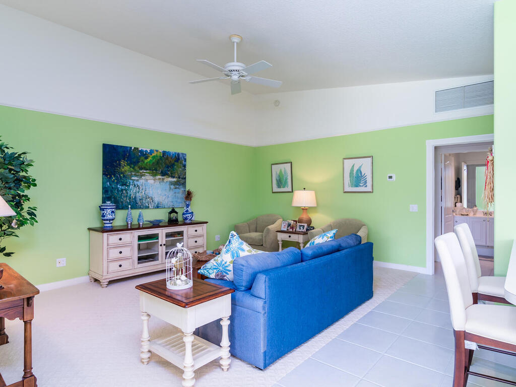 3074 Futuna Lane Naples, FL 34119 - Photo 4 of 28 a living room with furniture and a flat screen tv