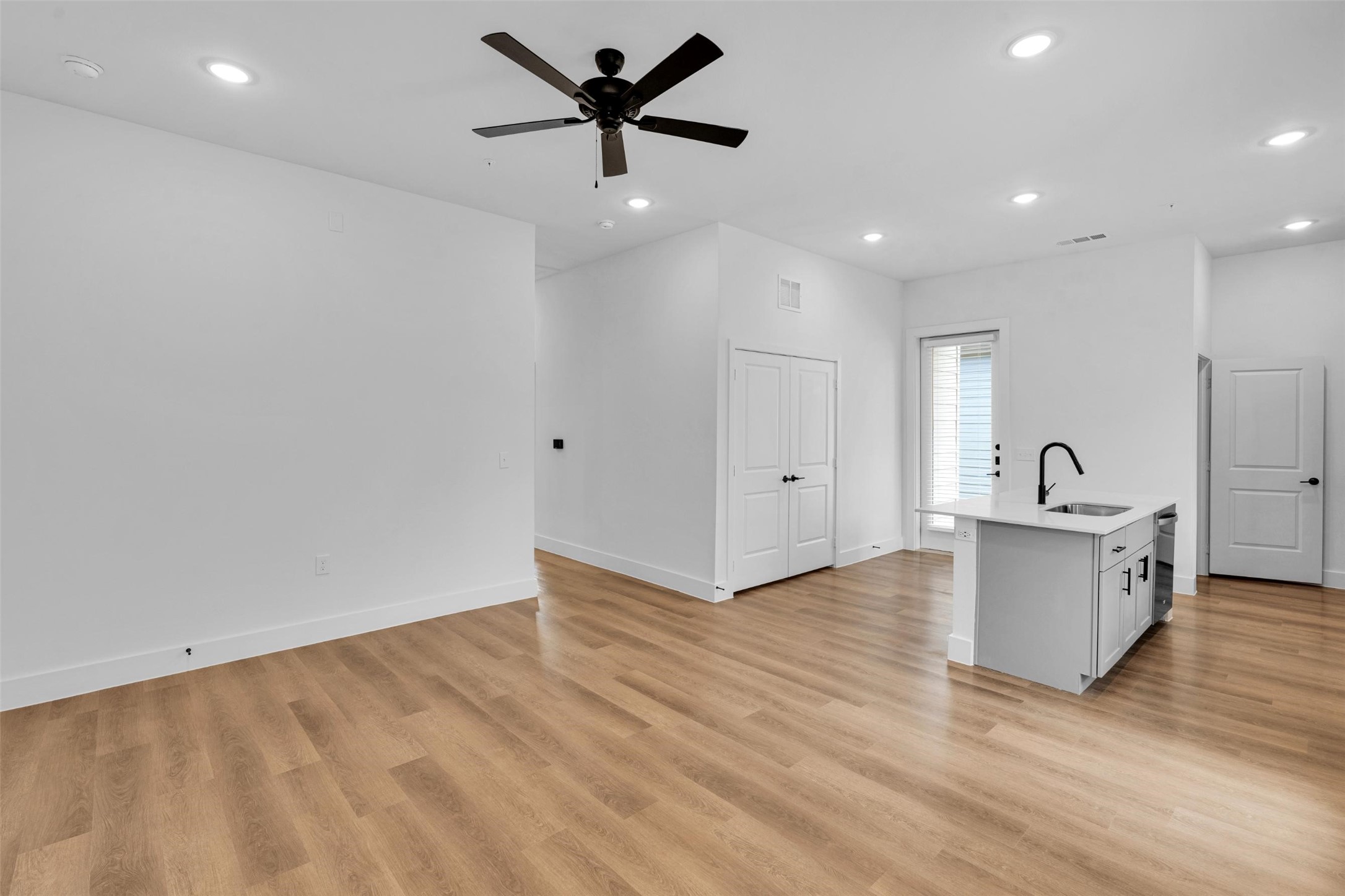 1621-204 Bernard Street Rowlett, TX 75089 - Photo 4 of 31 wooden floor in an empty room with a window