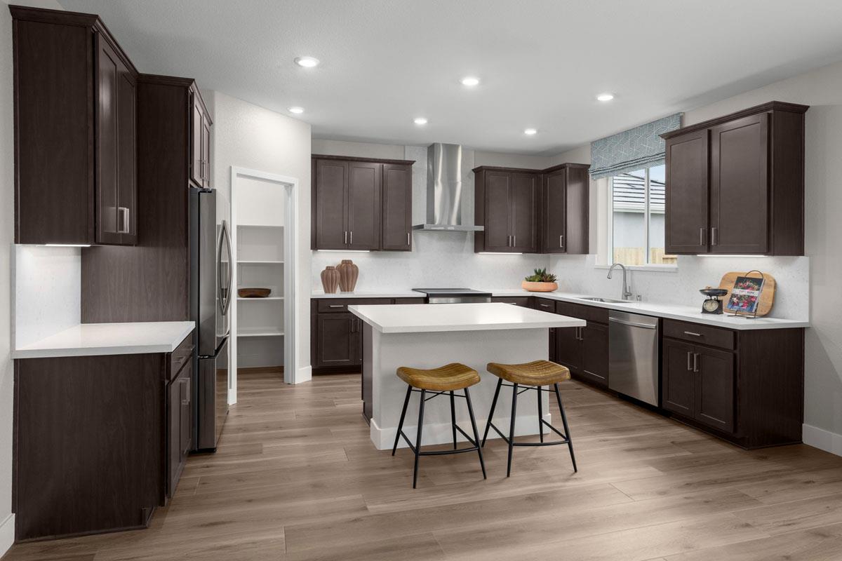 2331 Lingcod Way Rocklin, CA 95765 - Photo 3 of 6 a kitchen with a sink cabinets and wooden floor