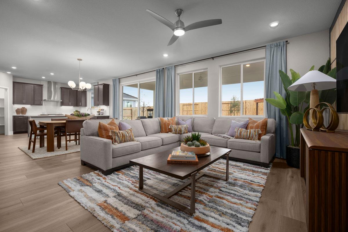 2331 Lingcod Way Rocklin, CA 95765 - Photo 4 of 6 a living room with furniture a fireplace and a table