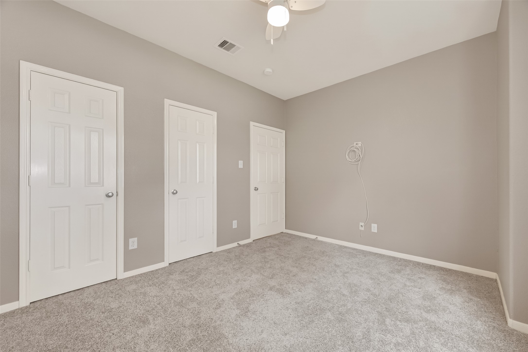 9110 Cavalier Lane Rosenberg, TX 77469 - Photo 21 of 30 This secondary bedroom features neutral-toned walls and fresh carpet. The simple and clean design offers a blank canvas for personalization.