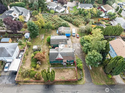 an aerial view of a houses with yard