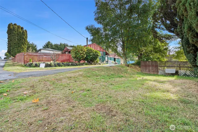 an aerial view of a house with a yard basket ball court
