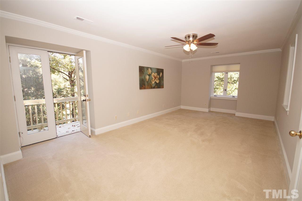 11605 Old Creedmoor Road Raleigh, NC 27613 - Photo 14 of 25 a view of an empty room with a window