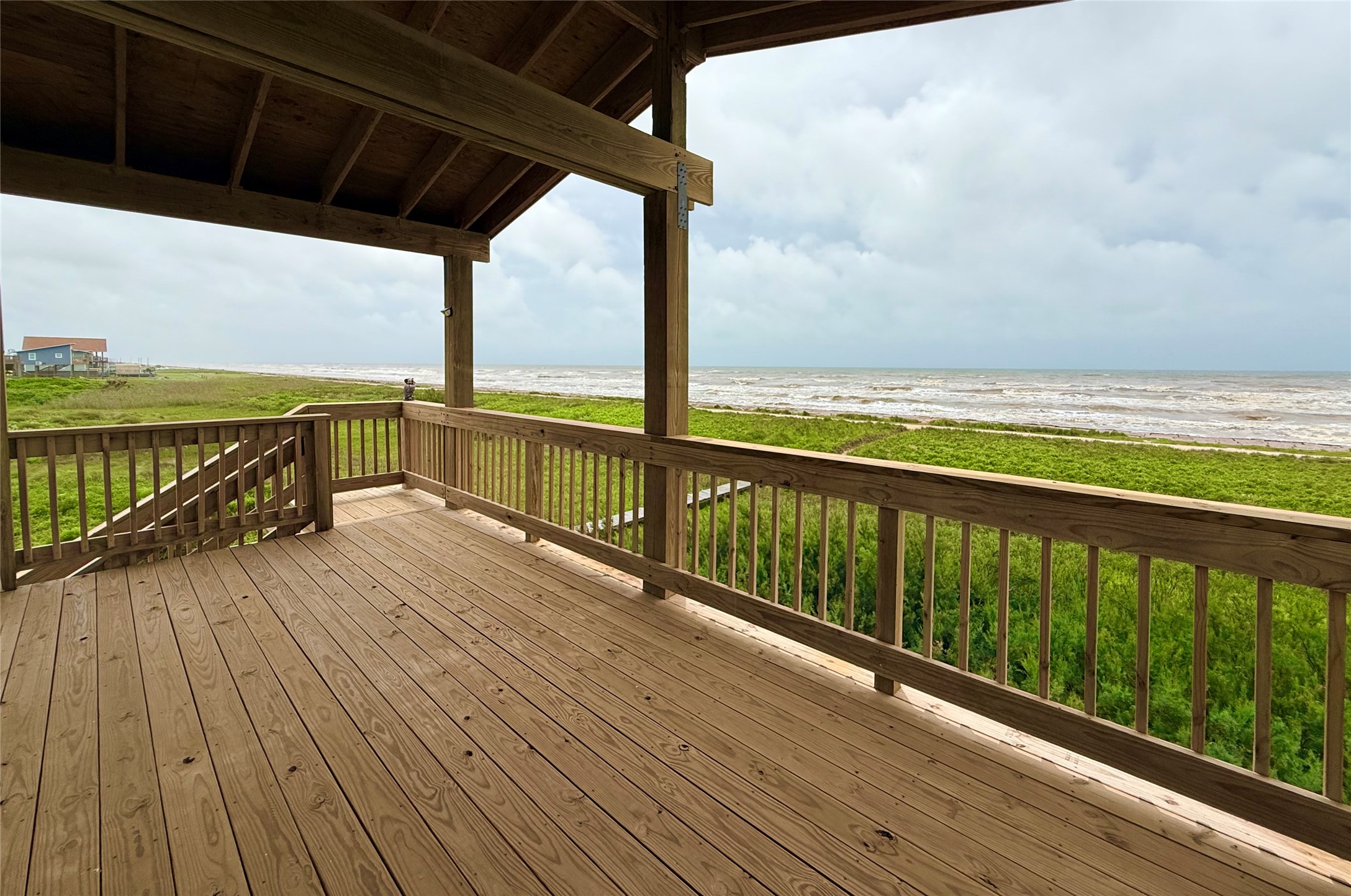 2154 County Road 230 Sargent, TX 77414 - Photo 2 of 30 a view of balcony with wooden floor
