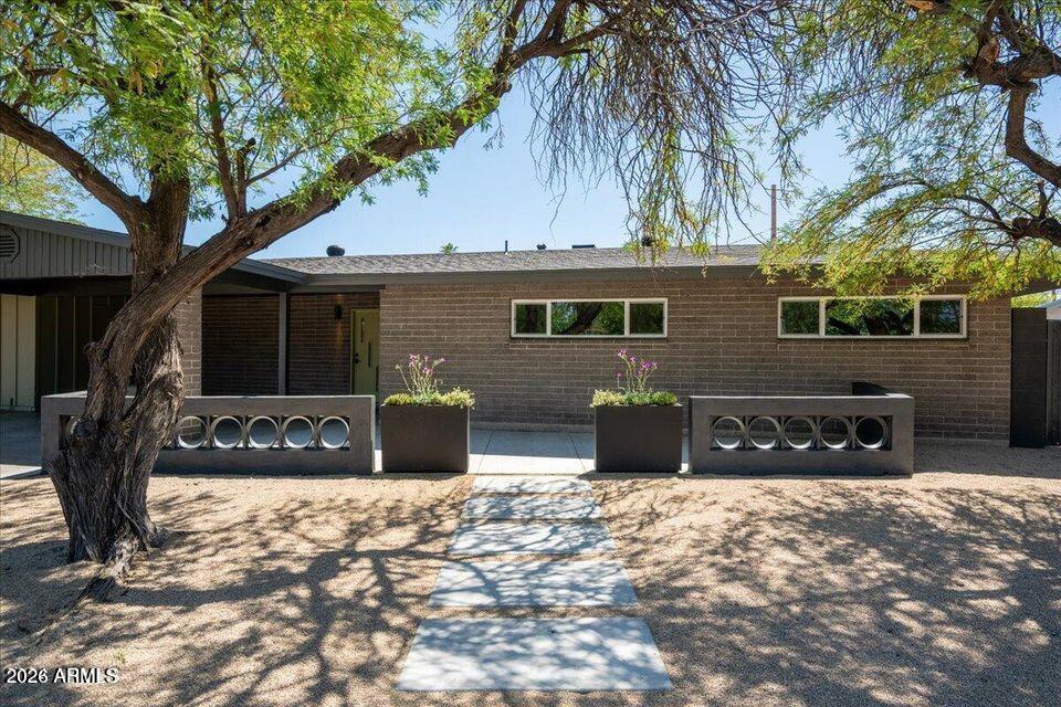 8049 North 10th Street Phoenix, AZ 85020 - Photo 14 of 40 a front view of a house with garage