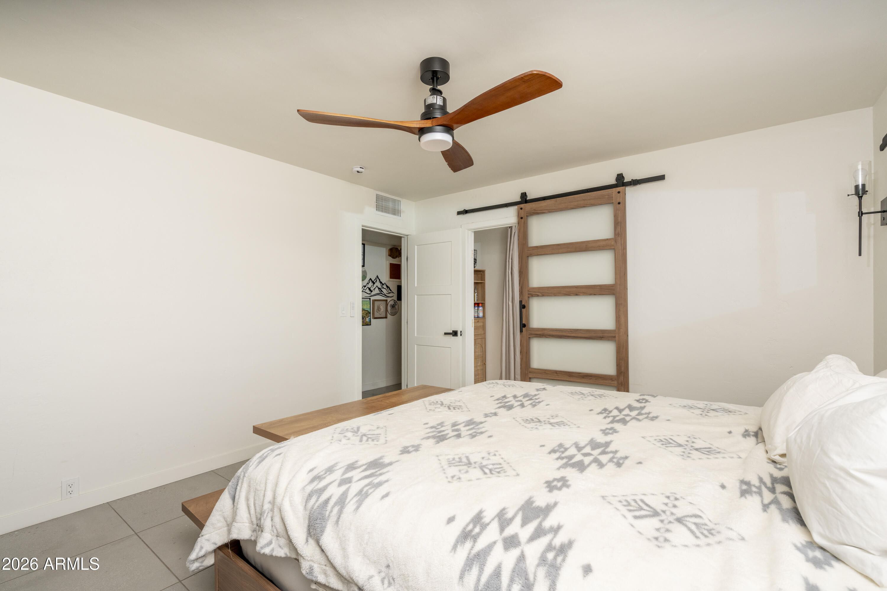 8049 North 10th Street Phoenix, AZ 85020 - Photo 17 of 40 a bedroom with a bed and a window