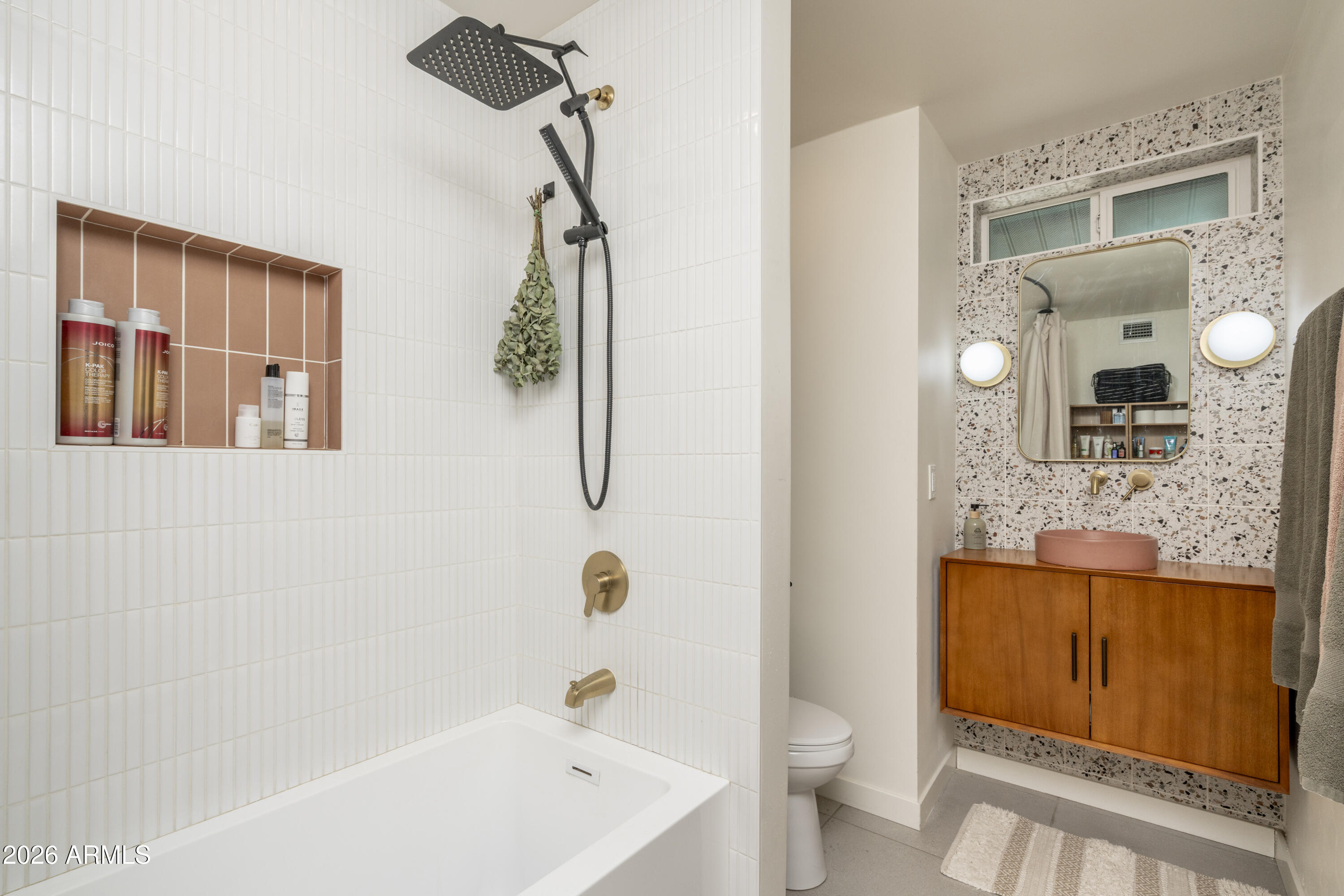8049 North 10th Street Phoenix, AZ 85020 - Photo 19 of 40 a bathroom with a granite countertop sink a toilet and shower