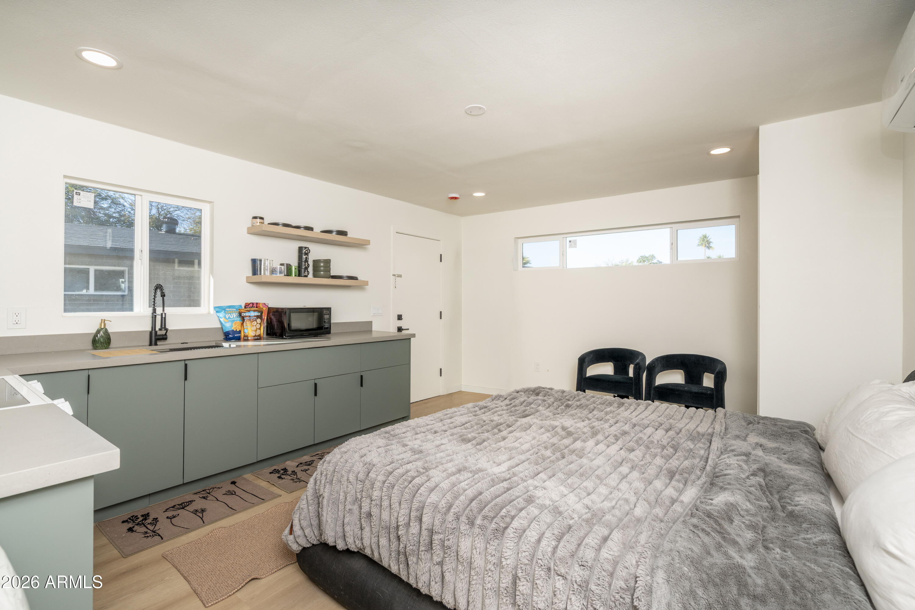 8049 North 10th Street Phoenix, AZ 85020 - Photo 24 of 40 a bedroom with a bed and a window
