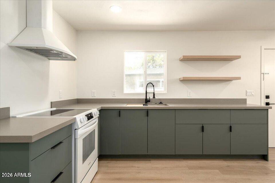 8049 North 10th Street Phoenix, AZ 85020 - Photo 29 of 40 a kitchen with a sink cabinets and a window