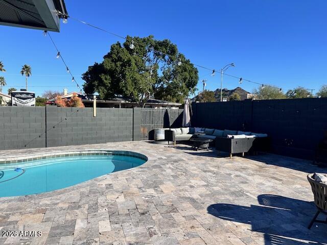 8049 North 10th Street Phoenix, AZ 85020 - Photo 32 of 40 a view of a swimming pool with a lounge chair